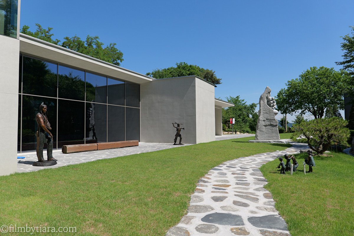 Bronze sculptures and stone garden outside Art Sanctum Gallery, FOREST AG405
