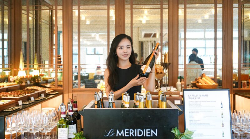Holding a bottle of Chandon Garden Spritz at La Palette Paris wine station, Le Meridien Seoul Myeongdong