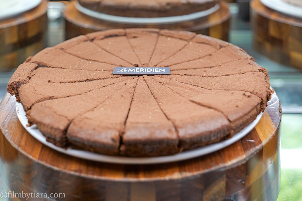 Sliced chocolate cake at La Palette Paris dessert counter