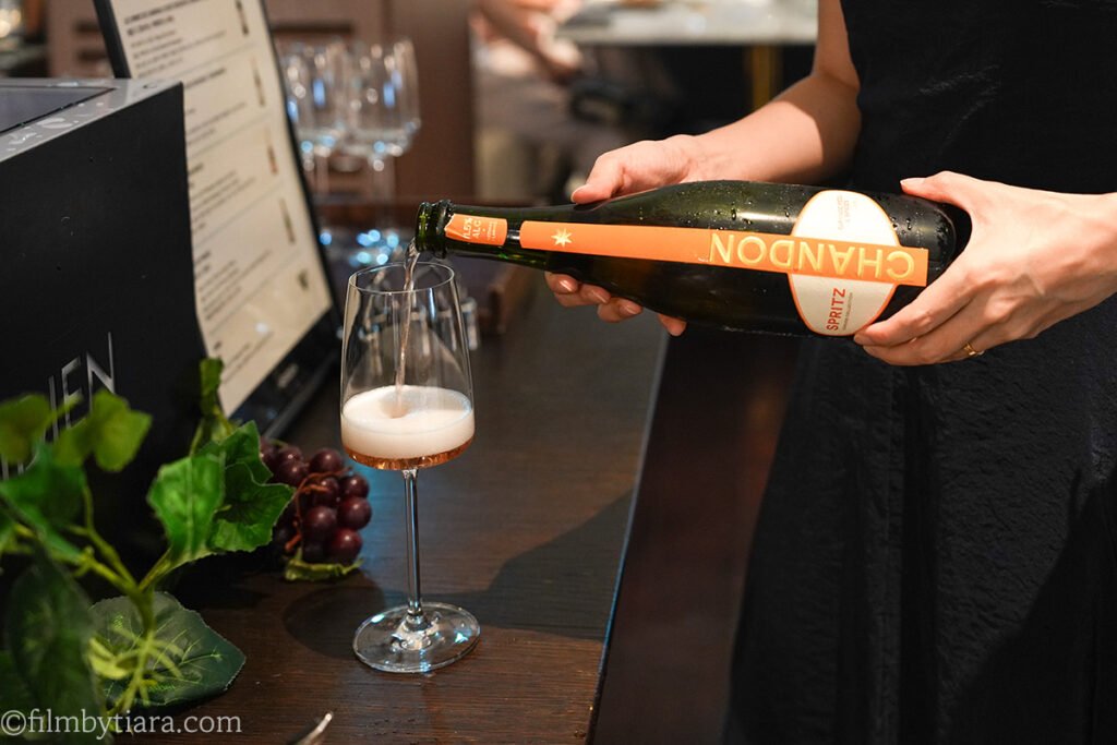 Pouring Chandon Garden Spritz at La Palette Paris bar counter