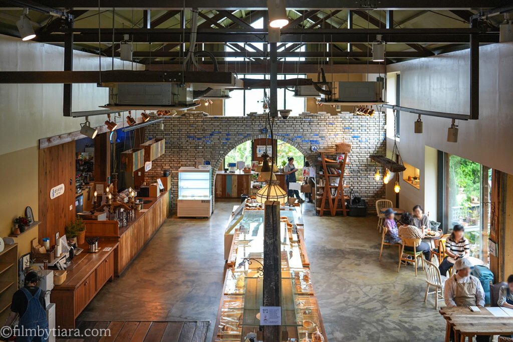 Interior of The Fore cafe with exposed beams and a brick archway