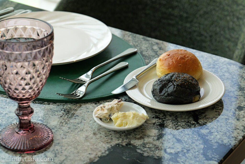 Table set with fresh bread and two butters at Voisin weekend lunch