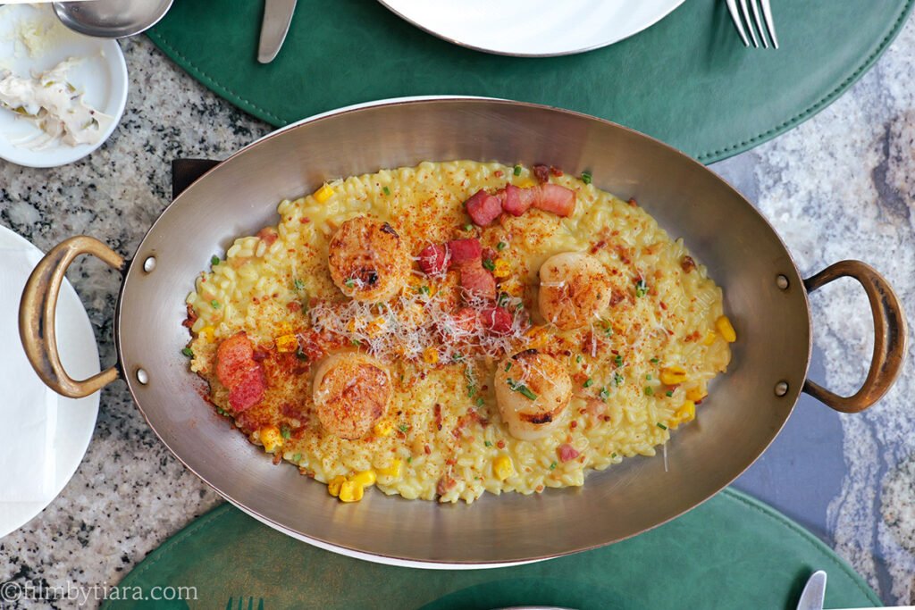 Sweet corn risotto topped with seared scallops at Voisin