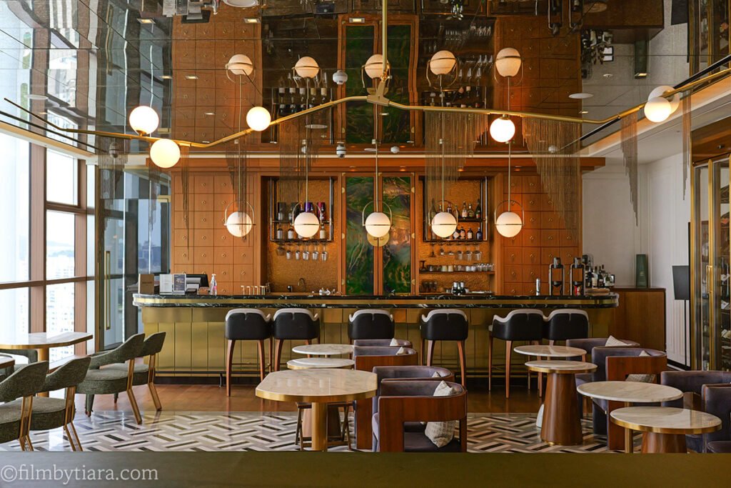 MRestaurant Voisin bar area with marble counter and globe pendant lights