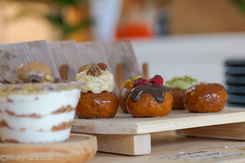 Display case featuring traditional Korean Gaeseong Juak desserts with various toppings