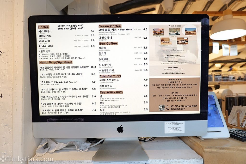 Coffee and beverage menu board displayed at the Gomae Coffee counter
